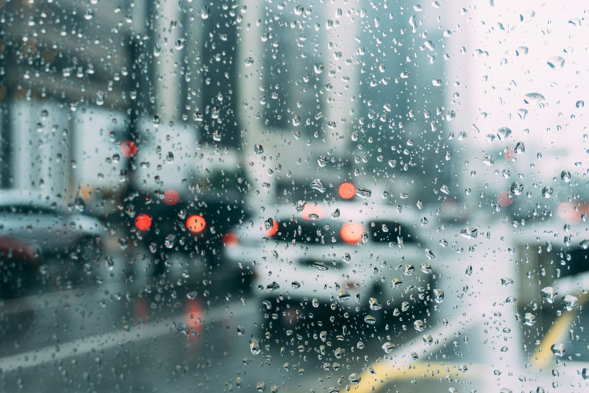 Rain on kerb after dusk during field return to the desk